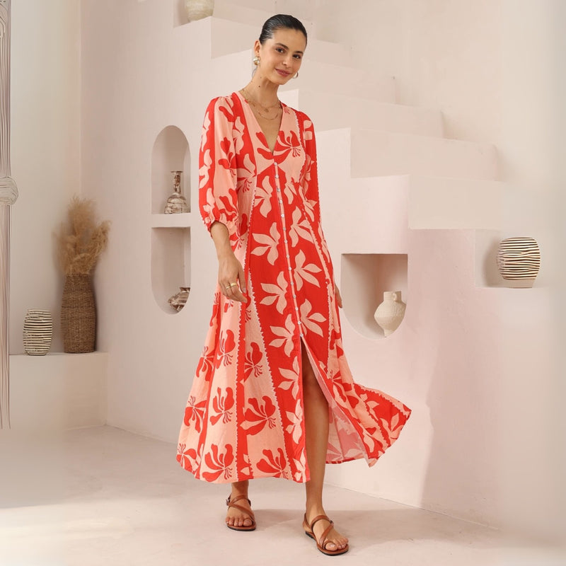 The dress has a button front and an Aline maxi length skirt with front split.