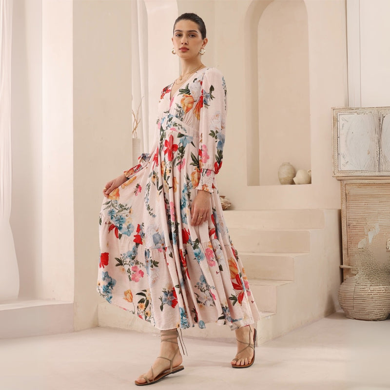 The dress has long sleeves with elasticated cuffs and a full maxi length skirt.