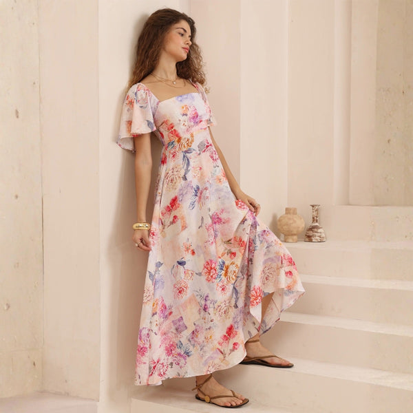 The dress has a square neckline, fitted bodice, flutter sleeves and a flowing maxi skirt.