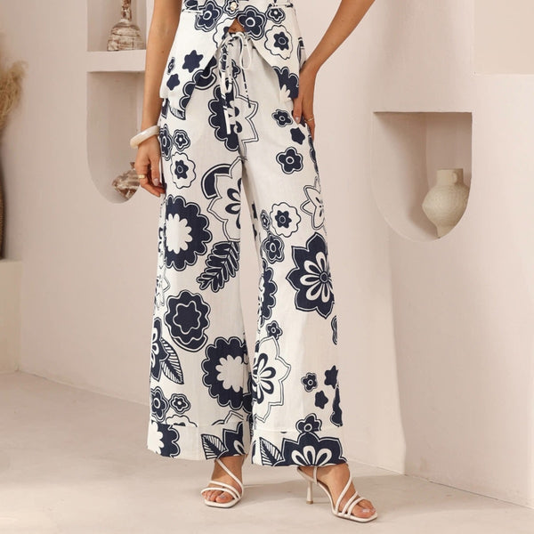 our Mariela Pants have a navy and white floral print. 