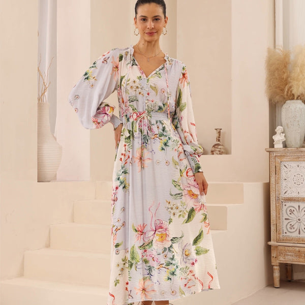 Our Oliana Dress has a grey base and a floral print. 