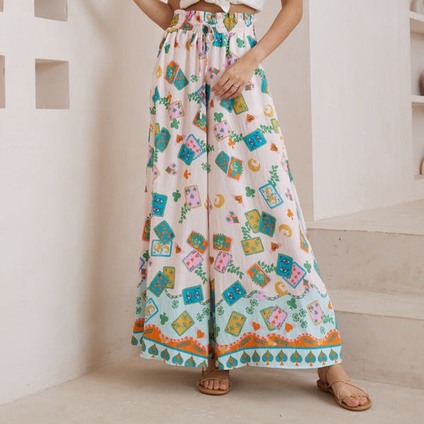 Our Sacred Heart Palazzo Pants feature a shirred waist with drawstring ties and a wide palazzo leg