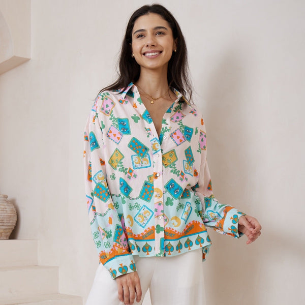 Our Sacred Heart Long Sleeve Shirt has a vacay inspired print in cream, blue, pink, mustard, orange and green