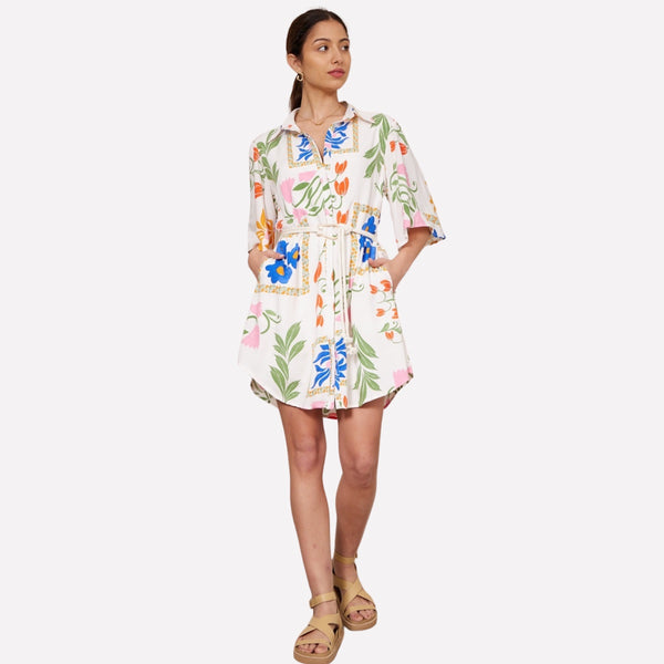 Our Sandy Shirt Dress has a bold floral print with a white base