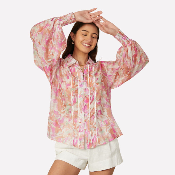 Our Tallulah Printed Shirt has a lovely abstract print in pink, green, terracotta and white