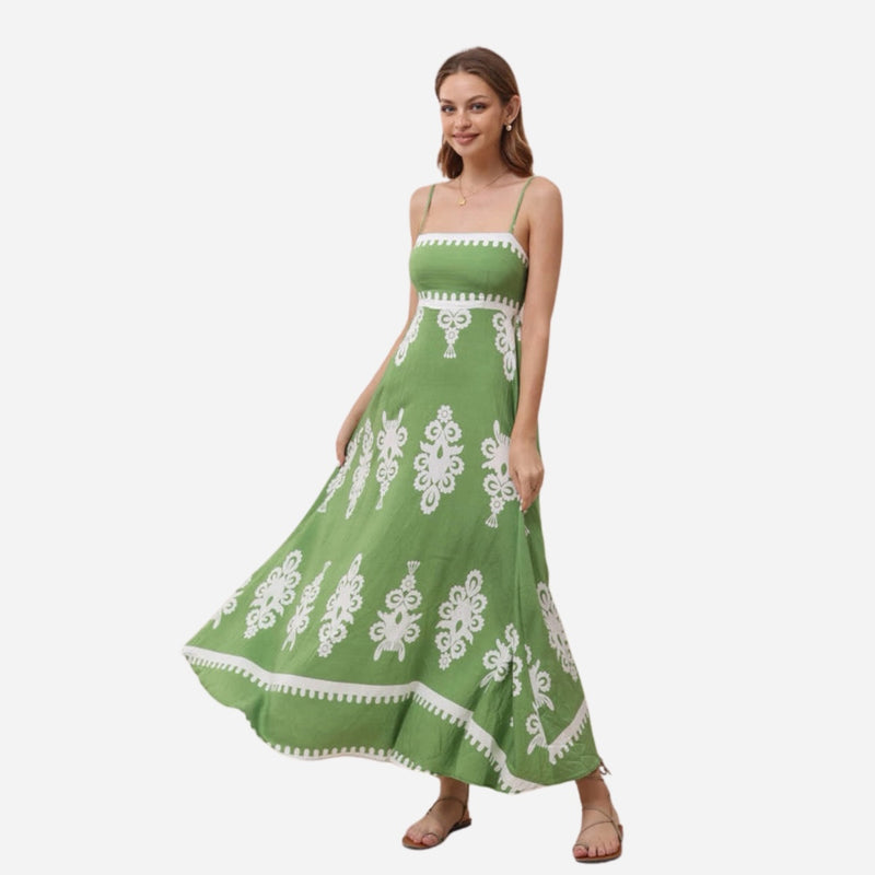 This sundress features thin shoulder straps, fitted bodice and a full maxi length skirt.