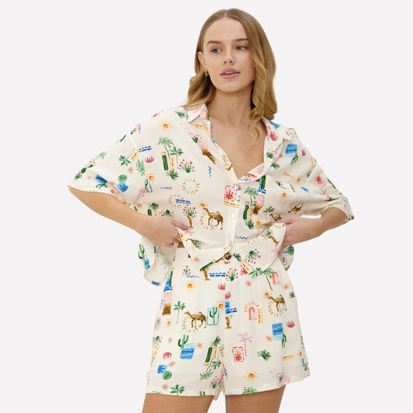 The Tropical Sands Short Set includes a matching shirt with button front and the tailored shorts