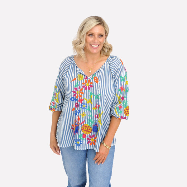 The top has a round neckline with ties finished with blue tassels. The long sleeves can also be pushed up to a shorter length.
