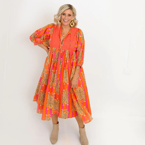 Our Jianna Dress has a fab tiger print with pink and orange stripes.