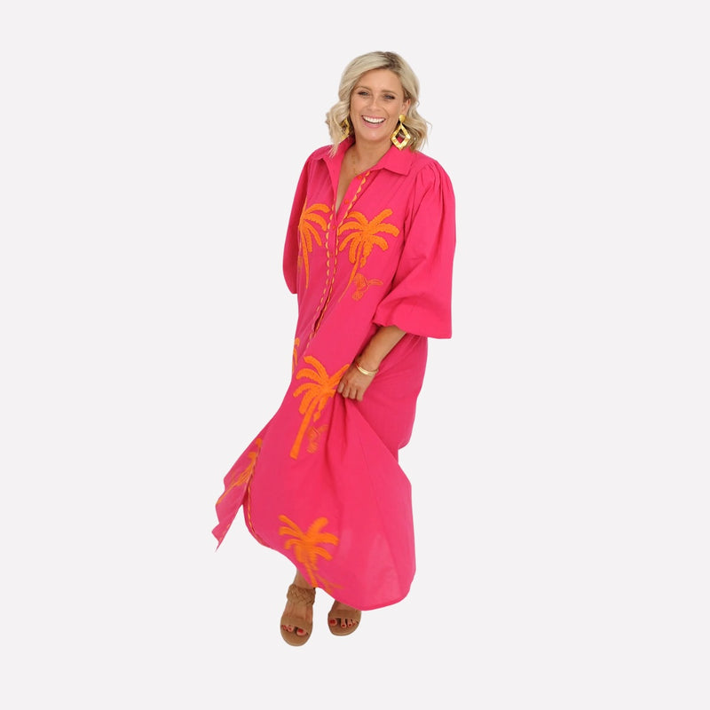 This maxi length dress features a collar, long sleeves with elasticated cuffs.