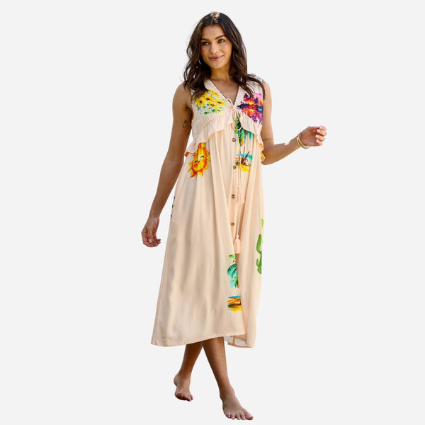 Our Cactus Rose Dress has a resort inspired print and features a V neckline, loose flowing midi skirt.