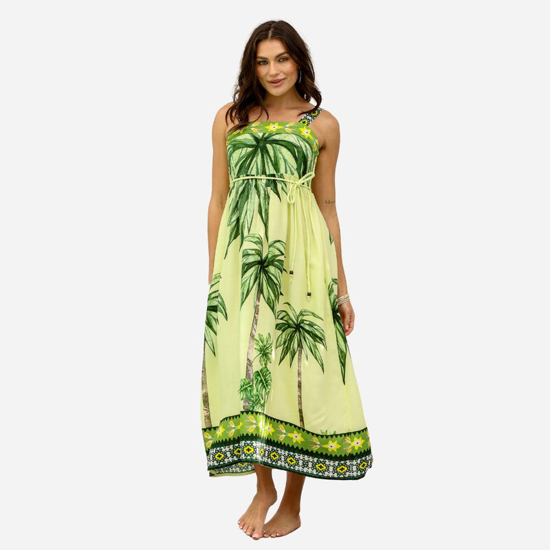 Our Palm Coast Dress has a bold green palm print. This sundress features a square neckline, shoulder straps and a full midi length skirt.