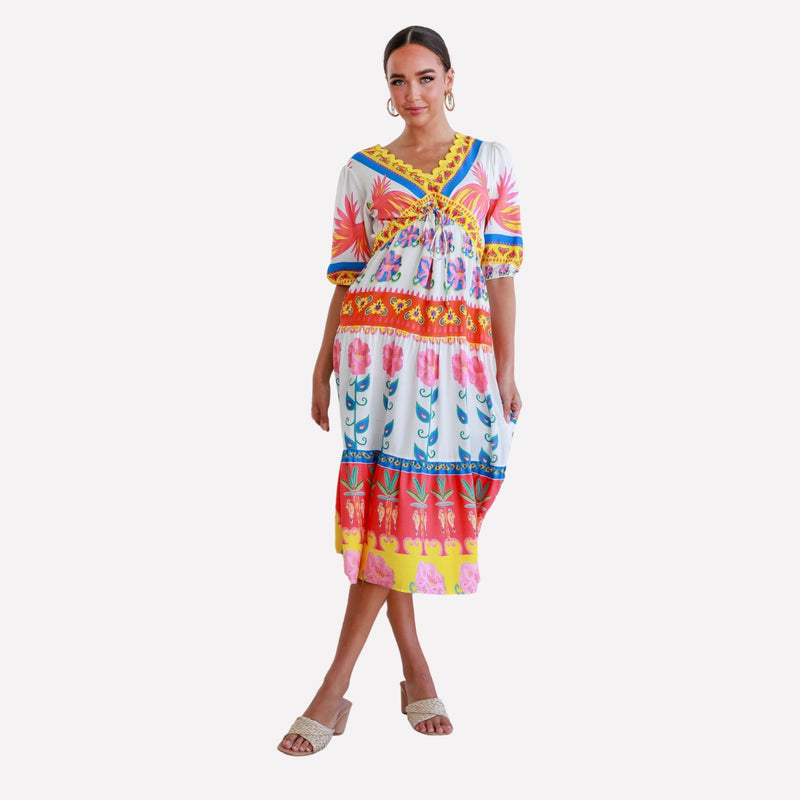 Tullia Maxi Dress with a vibrant print in white, pink, yellow, blue and red