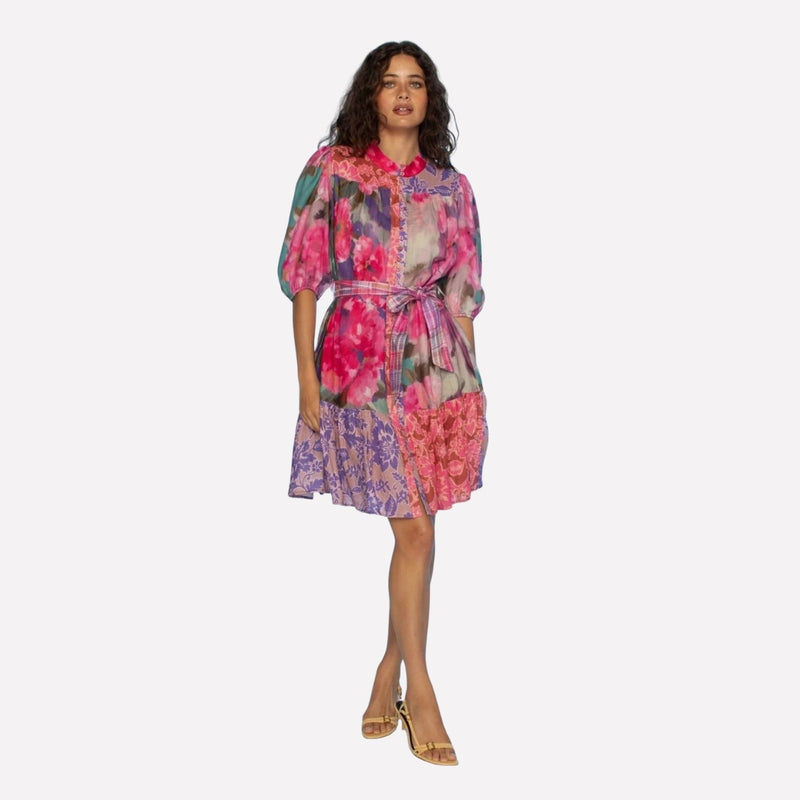 The dress has 1/2 length sleeves, a button front and a frill hem finishing above the knee.