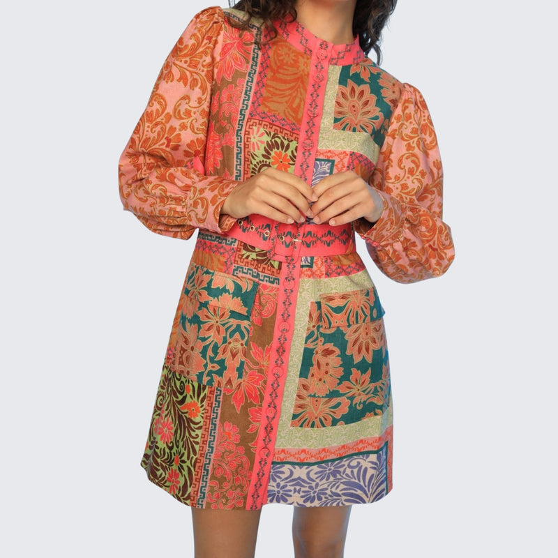 This mini dress also has flap pockets positioned on the hips.