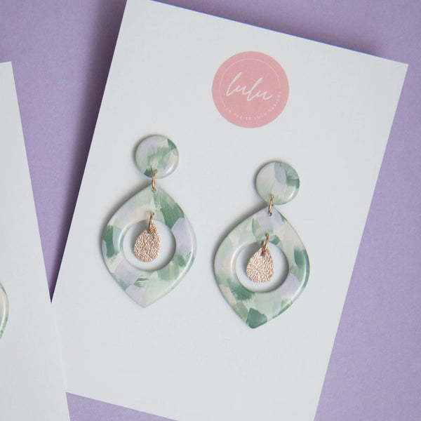 Florence Resin Dangle Earrings - artwork Kindled Sage - in a green, cream and lilac colour.