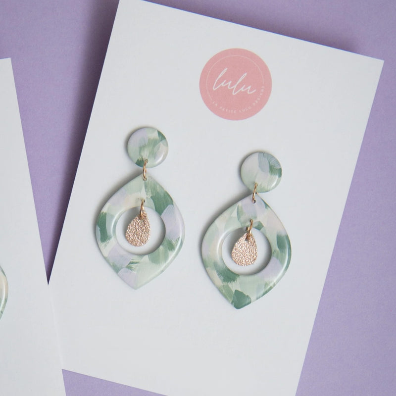 Florence Resin Dangle Earrings - artwork Kindled Sage - in a green, cream and lilac colour.