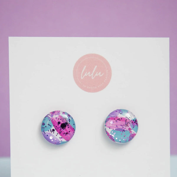 These Round Stud Earrings in Sweetheart Sparkles are colourful and have pink, lilac, blue and white speckles.