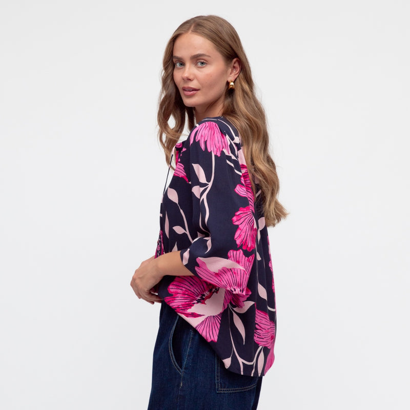 Side view of the top - it has a longer length at the back.