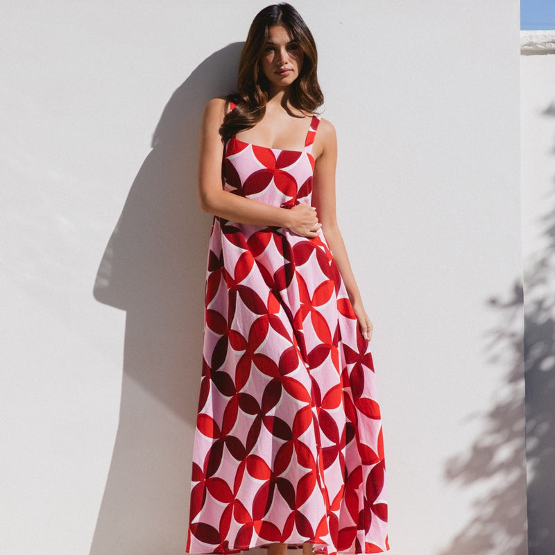 This dress has a square neckline, fitted bodice and a maxi length skirt.