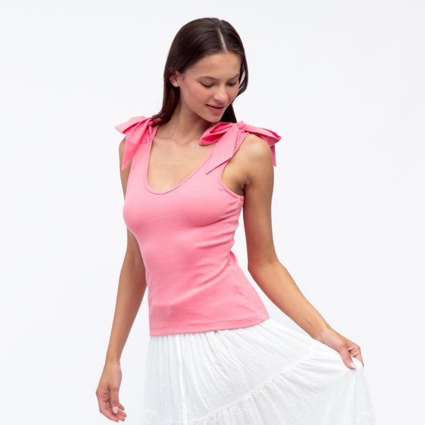 This pink singlet top has a deep scoop neckline at the front, bow ties on the shoulder.