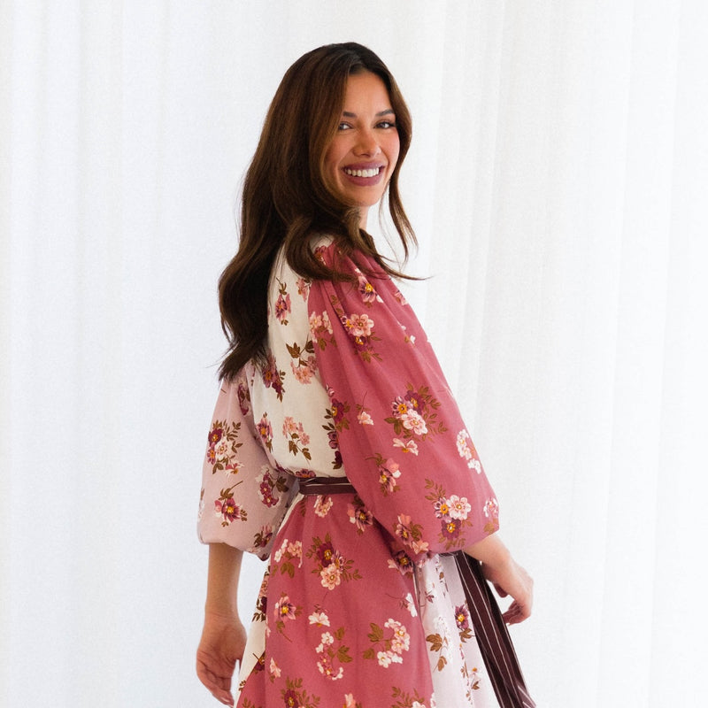 Upper side view - the dress has long sleeves that have been pushed up to half length.