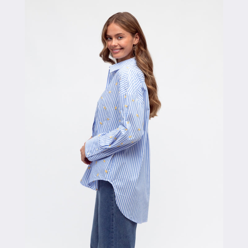 Side view showcasing the curved hem and its longer at the back.