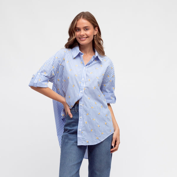 Our Lemon Stripe Shirt has blue and white stripes with embroidered lemons throughout.