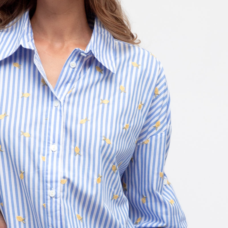 Close up of the embroidered lemon detail.