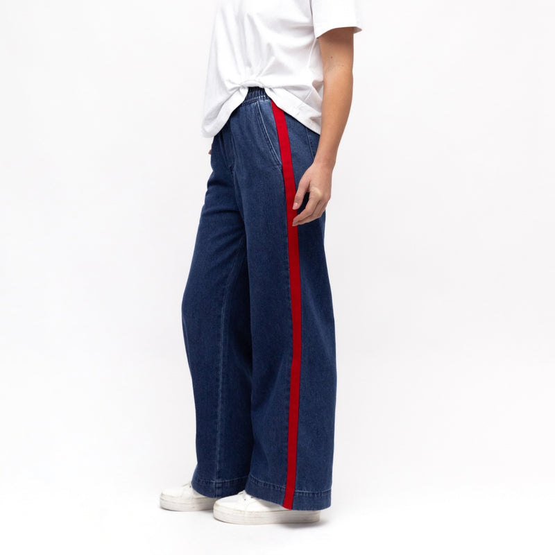 Side view of the pants showcasing the red stripe down the side of the leg.