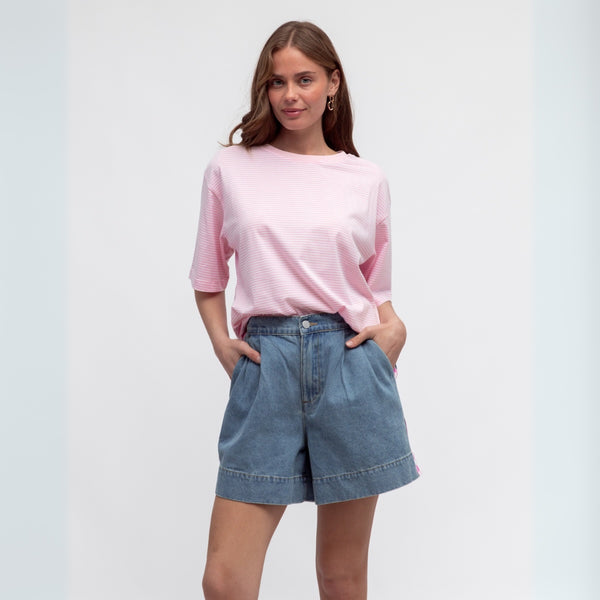 These blue denim shorts can be worn with a tee for a casual look.
