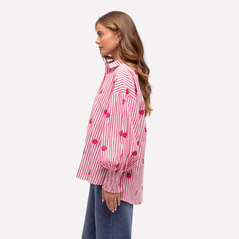 Side view of the shirt - it has a curved hem and is longer at the back.