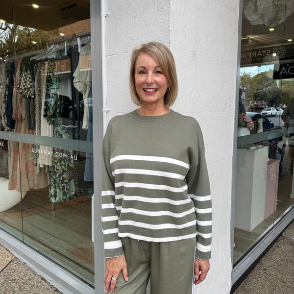 Our Lottie Stripe Sweater in khaki with white stripes.