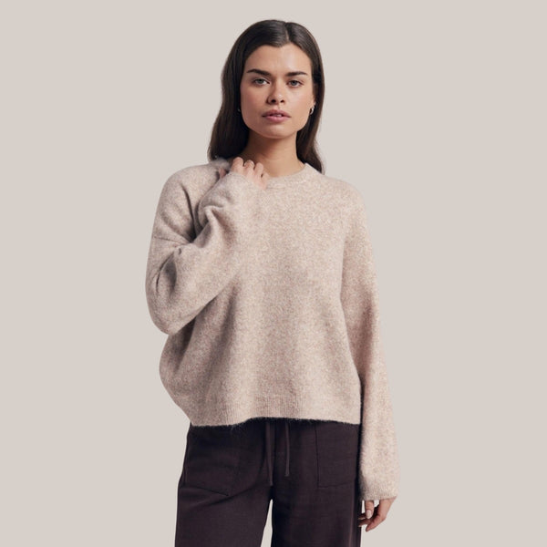 Our Otto Jumper is available in a beige colour. It has a ribbed round neckline, long sleeves and a ribbed hem.