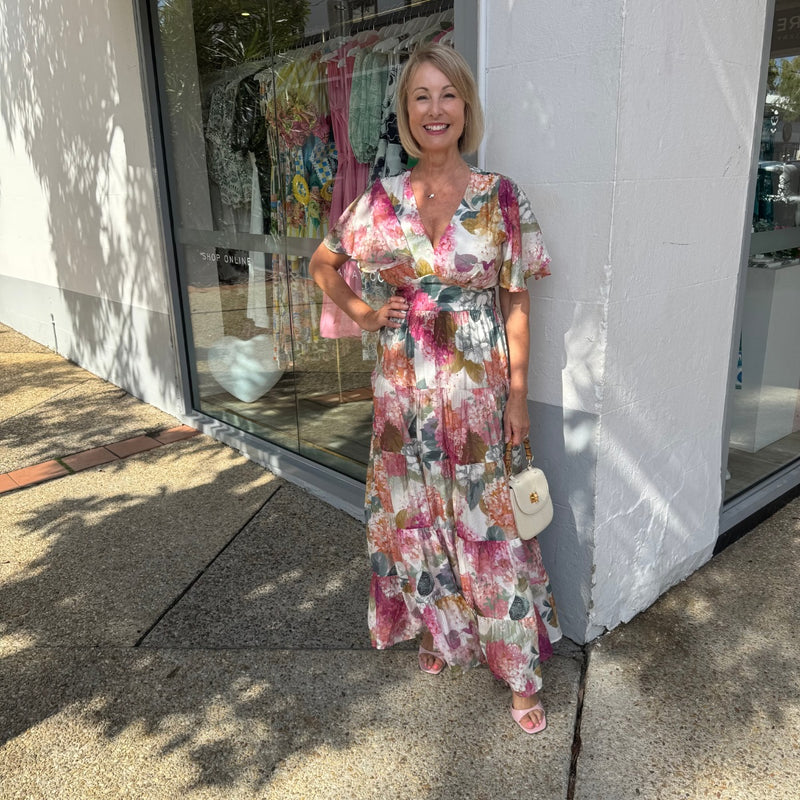Our Botanic Floral Maxi Dress has a lovely muted floral print in white, pink, green and brown tones.