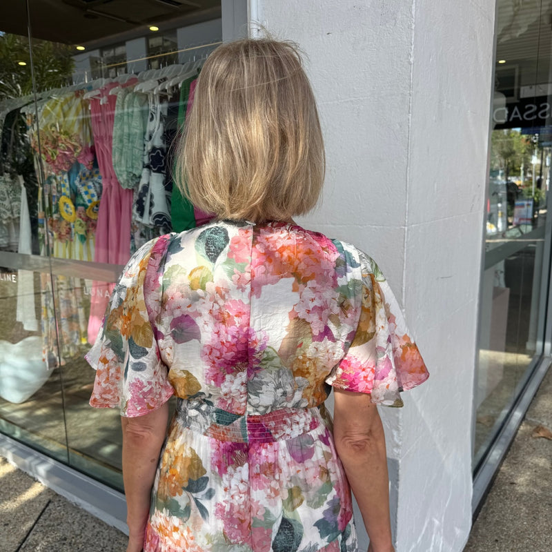 Upper back view - it has an invisible zip and also a shirred panel on the back of the waist.