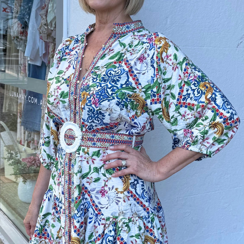 Close up of the print and bodice area - showcasing the gold buttons and statement self fabric belt with white raffia buckle.