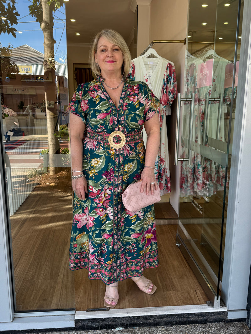 Jill (instore) is 170cm tall, is typically a Size 14 and wears a Size 14 in this beautiful dress.  Accessorised with a pink clutch.