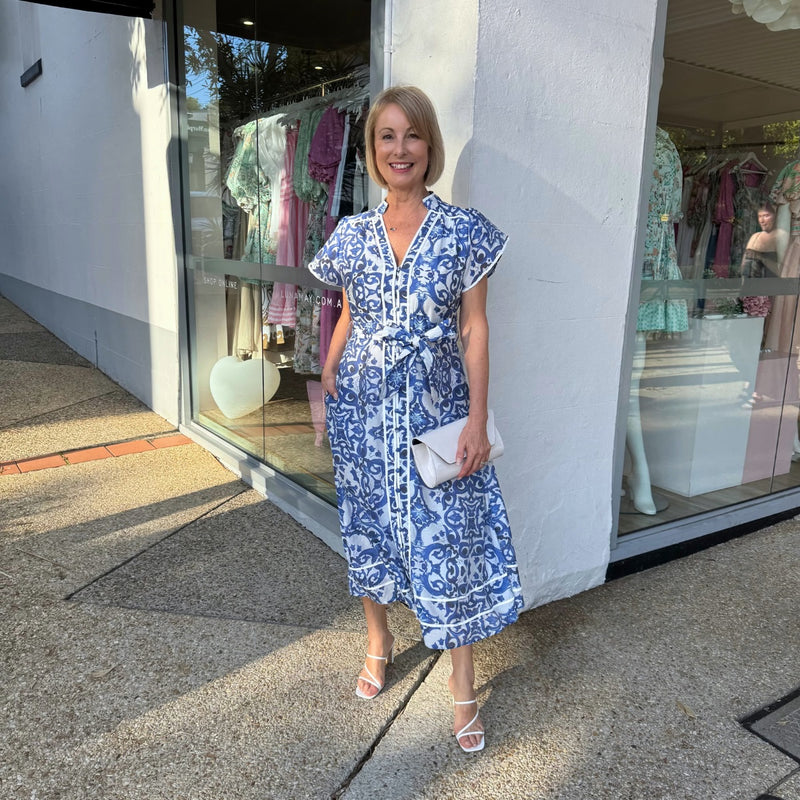 Our Kacey Dress is available in a blue and white multi-print.