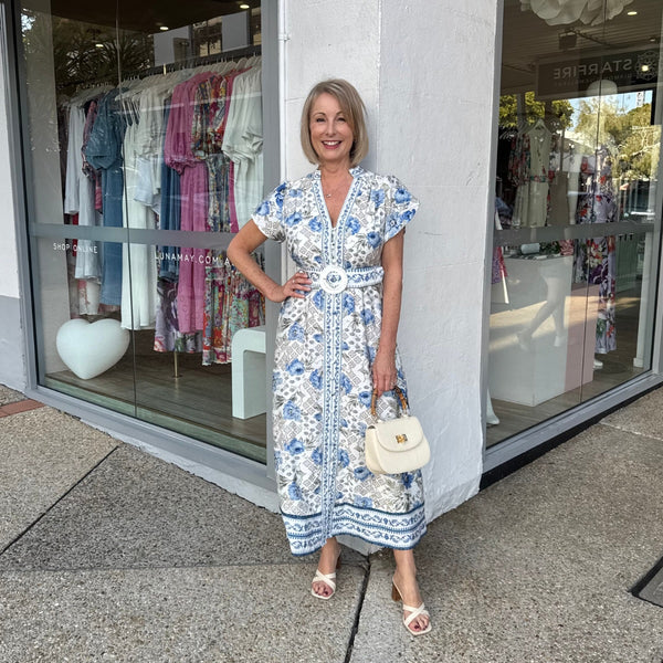 Kacey Midi Dress in a blue and grey floral print.
