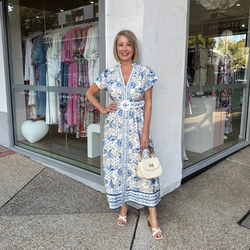 Kacey Midi Dress in a blue and grey floral print.