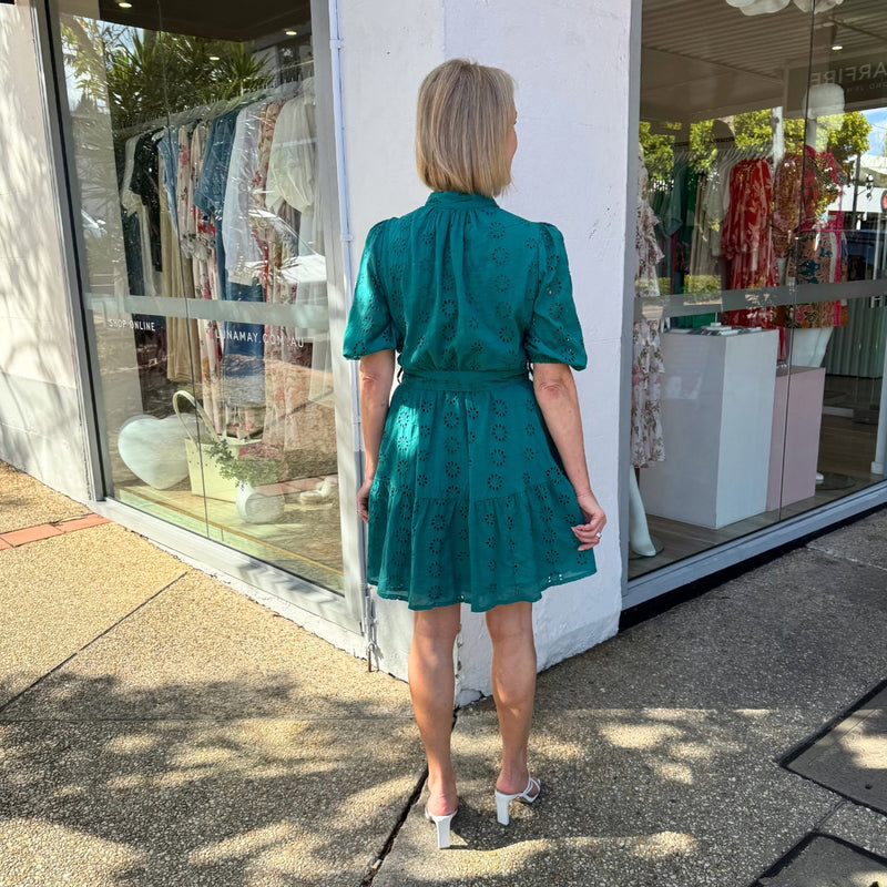 Full length view of the back of the dress - it has a frill hem.