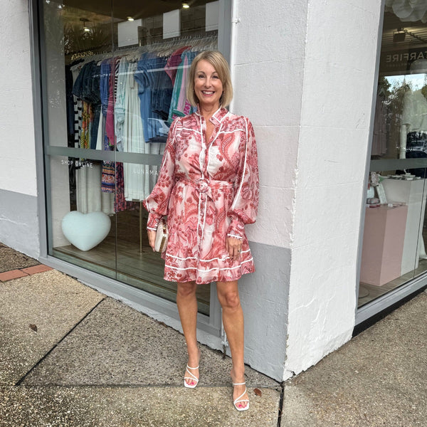 Our Tawnie Dress is available in a pink and white floral print.