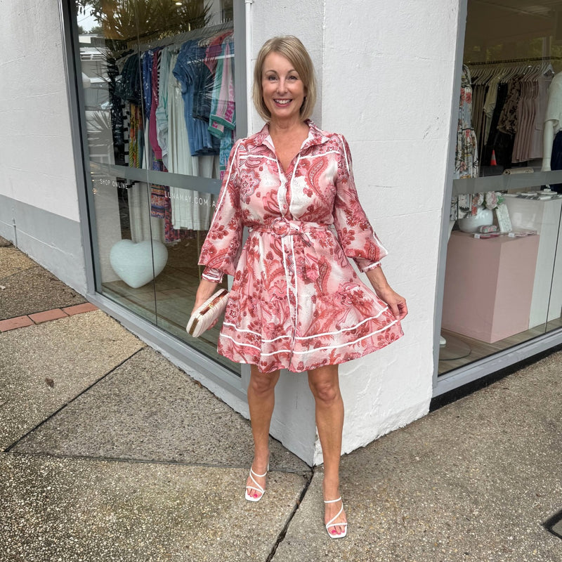 The dress also has beautiful silky white ribbon accents on the sleeve, button front and the hem.
