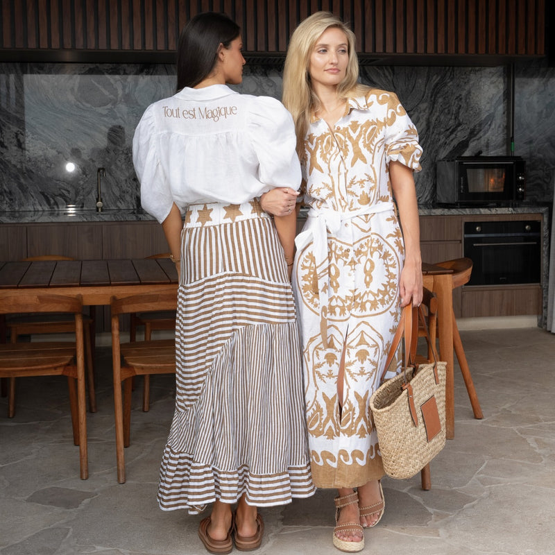 Full length back view of the shirt worn with the Simone Stripe Skirt (pecan).