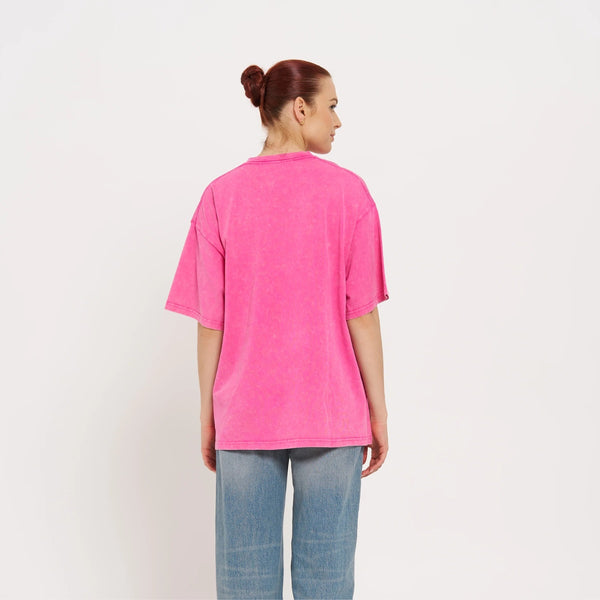 Back view of the tee - it has drop shoulders and a relaxed, oversize fit.