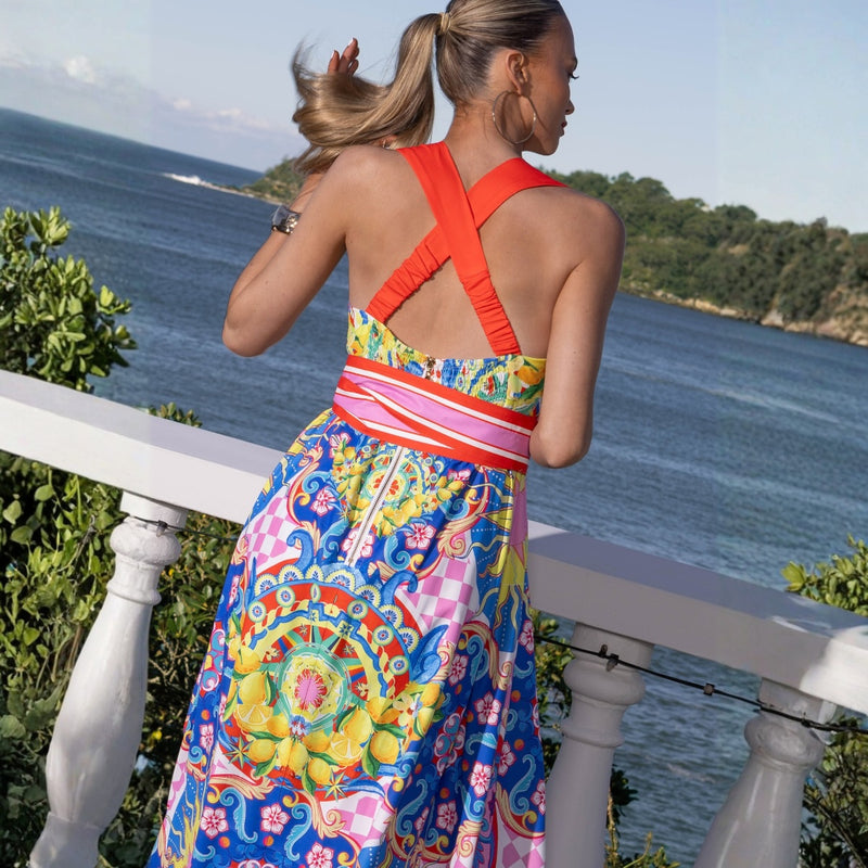 Upper back view of the dress showcasing the crossover straps which have a shirred panel for comfort.