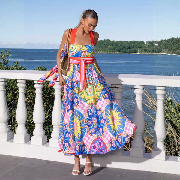 Our Liyana Maxi Dress has a colourful and bold Summer in Sicily print (blue, pink, white and red)
