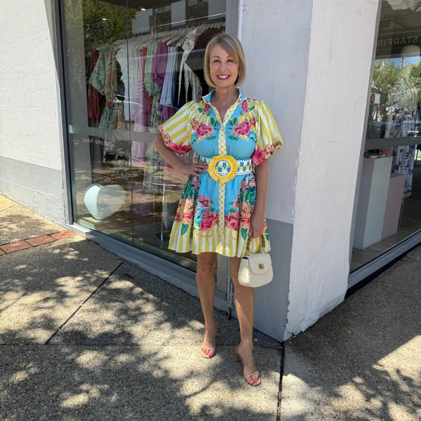 Positano Mini Dress in a yellow and blue print.