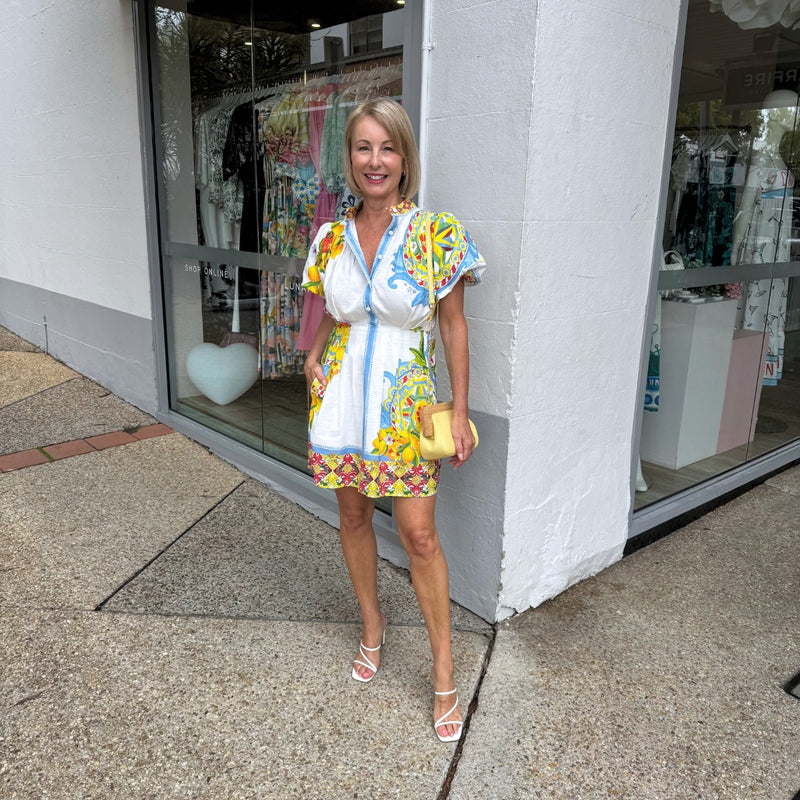 This gorgeous short dress has a fit and flare shape.